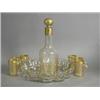 Image 1 : A late 19th century liqueur set, the decanter and six cups with gilt vermicelli decoration, upon...