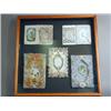 Image 1 : Five Victorian assorted silk and paper lacework occasional cards, mounted under a single cabinet...
