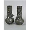 Image 1 : A pair of 19th century Chinese bronze vases cast with dragons, 25cm high Est. 200/300...
