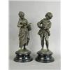 Image 1 : A pair of late 19th century spelter figurines modelled as a boy writing and a girl reading upon w...