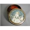 Image 1 : A continental yewwood snuff box with a painted lid of a lady seated on a bench, signed Jean**ey (...