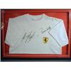 Image 1 : An official Ferrari tee shirt, signed by Michael Schumacher and Rubens Barrichello, with attached...