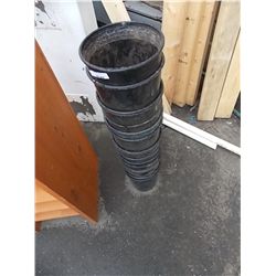 STACK OF BLACK PLANT POTS