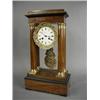 Image 1 : A late 19th century walnut portico clock, with an enamelled dial, marked A. Vassien, Paris, 45cm...