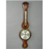 Image 1 : A George III mahogany wheel barometer, the body inlaid with paterae and stylised shells, the silv...