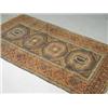 Image 1 : An antique Belouchi rug with geometric motifs on a red field, 186 x 100cm Est. 100/150...