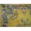 Image 1 : A Chinese yellow ground carpet with a wide blue border and a medallion centre, 3m 45cm x 2m 42cm...