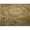 Image 1 : An Abusson tan ground handmade needlepoint carpet, 3.05 x 2.44m Est. 400/450...