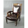 Image 1 : A Victorian oak framed open armchair, with replacement leather covering Est. 200/300...
