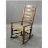 Image 1 : A 19th century elm (?) ladderback rocking chair Est. 200/300...
