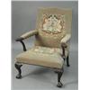 Image 1 : A Victorian mahogany library chair with an upholstered back and seat. The arms carved with humoro...