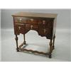 Image 1 : A William and Mary style walnut and crossbanded sidetable, with turned legs, united by a stretche...