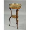 Image 1 : A late 19th century French walnut jardiniere two tier stand, the marquetry inlaid top with gilt m...