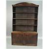Image 1 : A George III mahogany bookcase with an arched cornice and shelves over two panelled doors and pin...