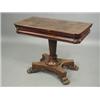 Image 1 : A Victorian mahogany fold over card table on paw feet, 92cm wide Est. 400/600...