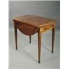 Image 1 : A late George III mahogany Pembroke table, the oval drop flaps with tulipwood crossbanding, friez...