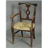 Image 1 : A stained beech childs armchair with straw seat Est. 150/200...