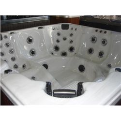 CAL SPAS COLEMAN SERIES HOT TUB WITH IVORY INTERIOR AND MAHOGANY CABINET. FEATURES INC: