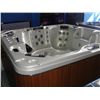 Image 1 : CAL SPAS ESCAPE SELECT SERIES HOT TUB WITH IVORY INTERIOR AND TEAK CABINET. FEATURES INC: