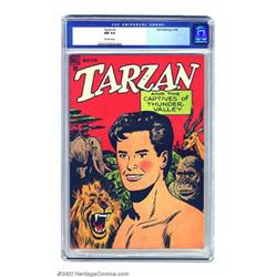 Tarzan #2 (Dell, 1948) CGC NM 9.4 Off-white pages. An interesting cover vividly displays Tarzan a...