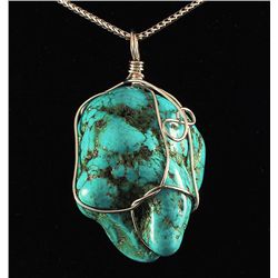 NATURAL 229.51CTW TURQUOISE WIRE WRAPPED PENDANT