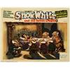 Image 1 : Snow White and the Seven Dwarfs (RKO, 1937). Lobby Card (11" X 14"). Snow White lies upon her dea...