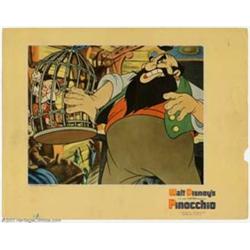 Pinocchio (RKO, 1940). Lobby Card (11" X 14"). Stromboli imprisons Pinocchio in a cage after the...