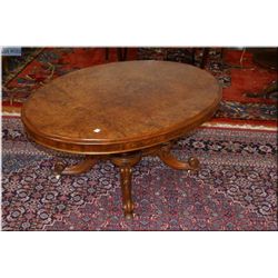 Victorian matched burl grain coffee table with interesting quad support center pedestal and original