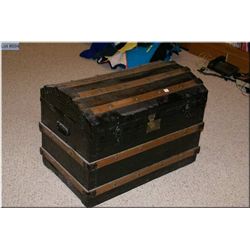Antique dome topped and oak bound steamer trunk