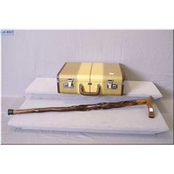 A small hard covered suitcase with fitted interior including jars and bottles made by Langmuire and 