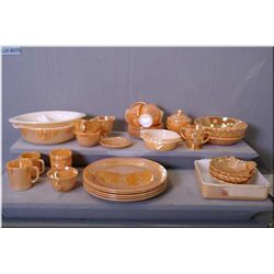 Large selection of Fire King iridescent peach dishes including five dinner plates, six cups and sauc