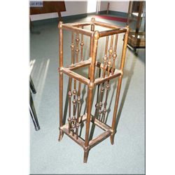 A three tier plant stand with turned spindle decoration