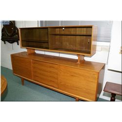 A Danish made teak sideboard with glass display sliding door, five drawer and two wooden sliding doo