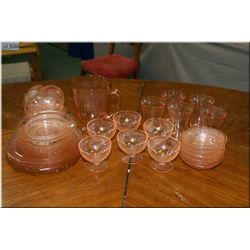 A selection of pink Depression glass style glassware including lemonade set with pitcher and five gl