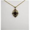 Image 1 : Elegant Red Garnet Pendant with approx. 2.00 carat garnet with diamond accents set in 10 kt. yellow 