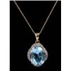 Dazzling 10k yellow gold pendant set with a center oval sky blue Topaz weighing approx. 6.00 carats 