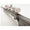 Image 7 : Savage Model 93 rifle in .22 Magnum caliber, stainless finish, composite stock, 3x9 x40 scope marked