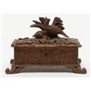 Image 1 : Small black forest style antique carved wooden box with game birds; old damage to front lid edge. Es