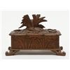 Image 3 : Small black forest style antique carved wooden box with game birds; old damage to front lid edge. Es