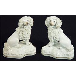 Pair of early 19th century Staffordshire porcelaineous seated poodles on cushions, 11cm high…