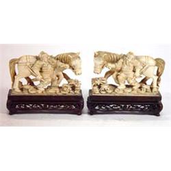 Pair of well detailed, oriental carved ivory horsemen on carved rosewood stands, each 10cm high…