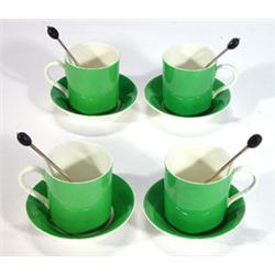 Four Hukin & Heath green porcelain coffee cans and four silver plated coffee bean spoons, Hukin &…