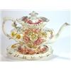 Image 1 : Hand painted pottery floral teapot on stand…