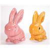 Image 1 : Pink glazed Sylvac style seated rabbit and an orange seated rabbit, tallest 17cm high…