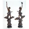 Image 1 : Two large French spelter figures of a man and woman on eaglebacks with raised arms 'La Nuit' and …