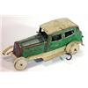 Image 1 : Tin plate clockwork model of a vintage green saloon, 20cm in length…