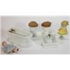 Two miniature porcelain dolls' house toilets, a bath, sink and two hand painted bisque dolls…