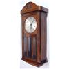 Image 1 : Oak cased chiming wall clock with visible pendulum and three bevelled glass panels…