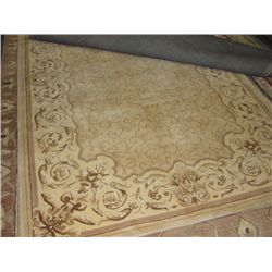 APPROX 5'X8' WOOL PILE AREA RUG - BEIGE AND EARTH TONES WITH BEIGE BORDER