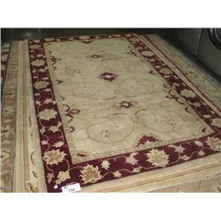 APPROX 5'X8' WOOL PILE AREA RUG - BEIGE CREMEAND BURGANDY WITH BEIGE BORDER